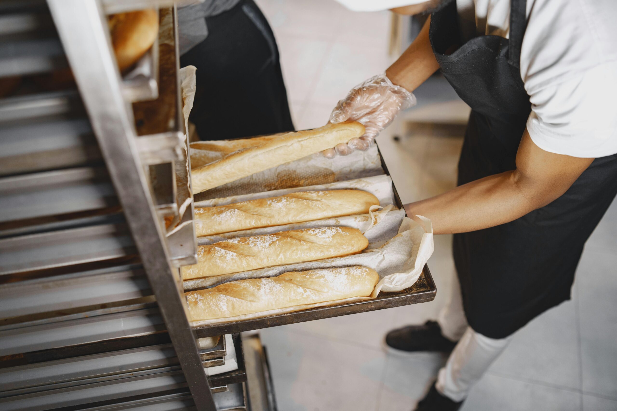 arms holding baguettes food inspection